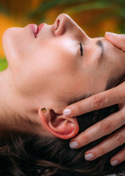 Female patient relaxing during cranial osteopathy session