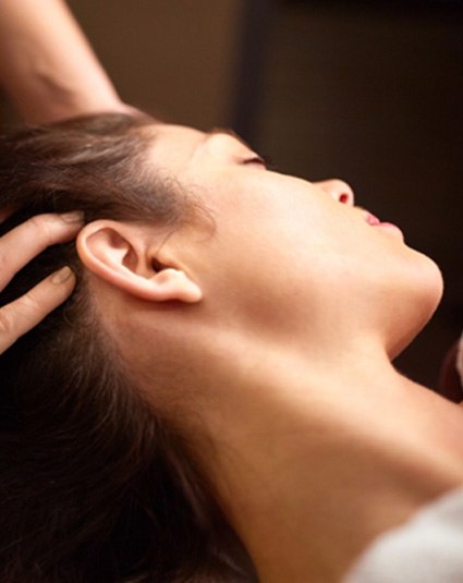 Woman relaxing during cranial osteopathy session in Hollywood