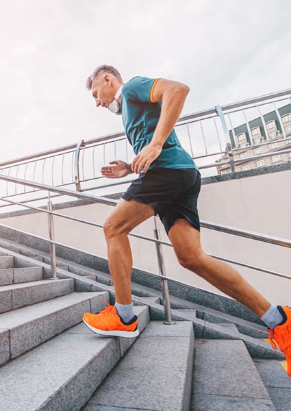 Man running up stairs, enjoying results of Prolozone therapy